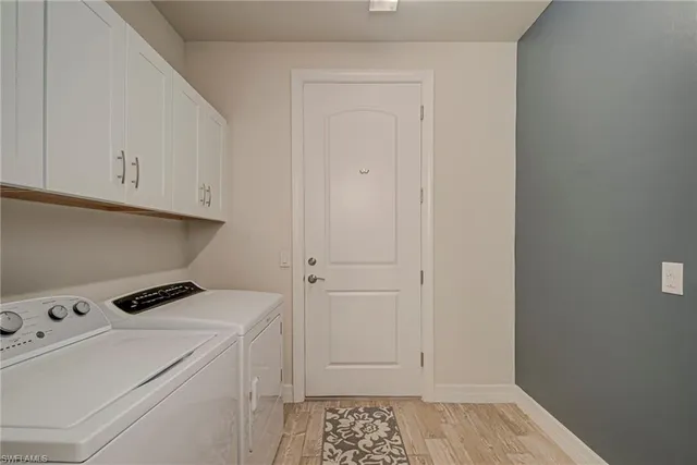 a view of storage and utility room with washer and dryer