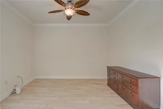 a view of an empty room and wooden floor