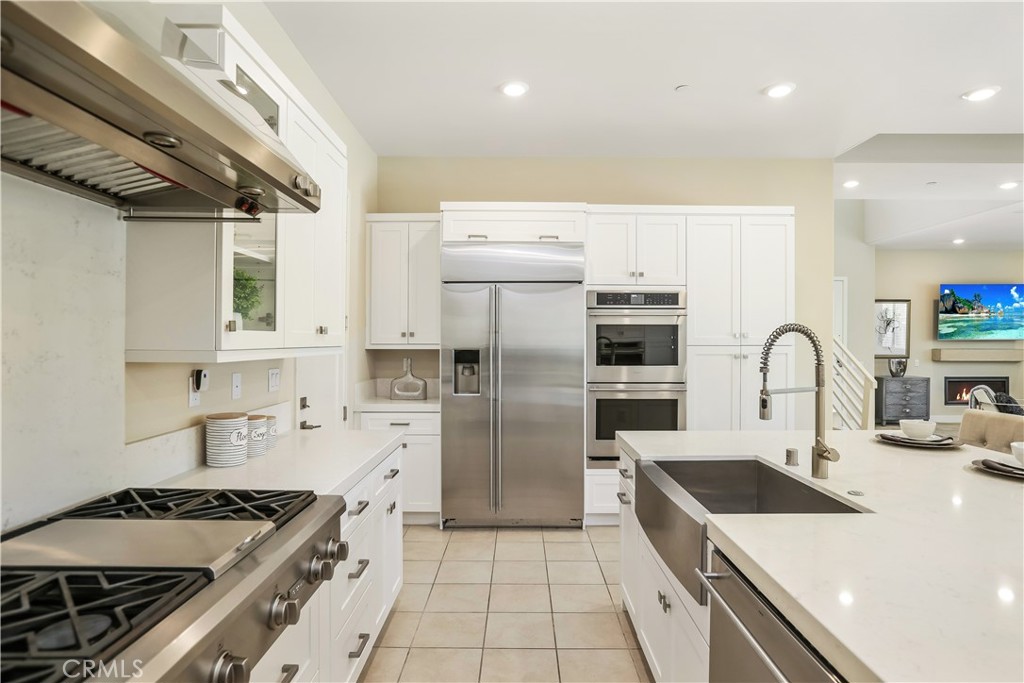 117 Swift Irvine, CA 92618 - Photo 17 of 62 a kitchen with stainless steel appliances granite countertop a stove a sink and a refrigerator