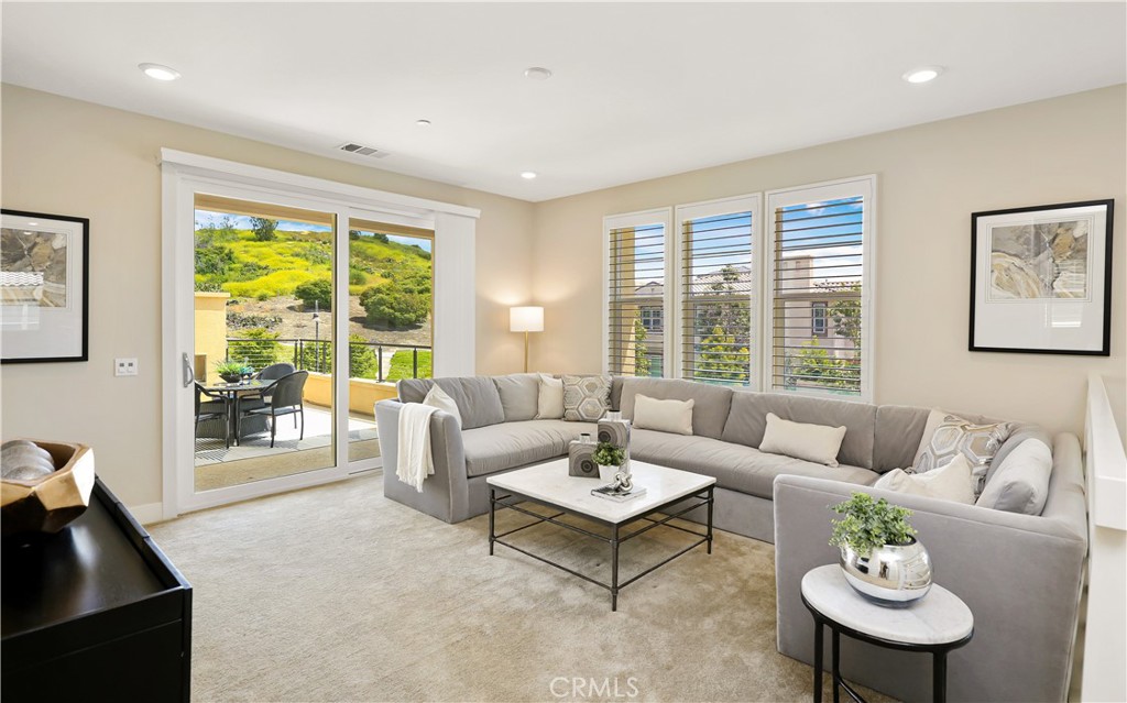 117 Swift Irvine, CA 92618 - Photo 32 of 62 a living room with furniture and a large window