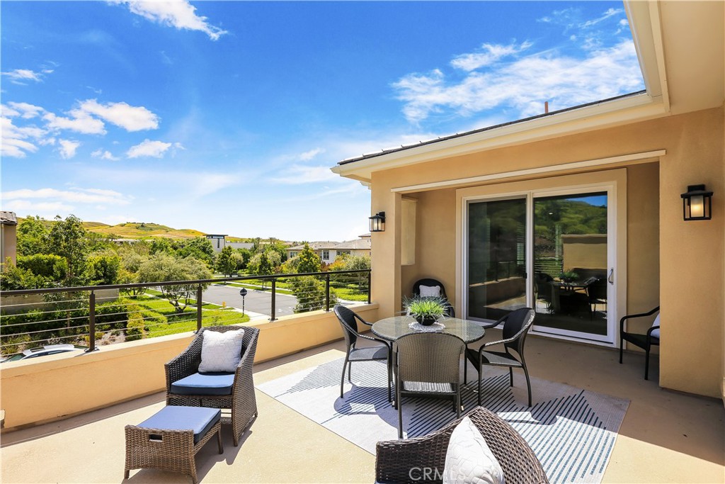 117 Swift Irvine, CA 92618 - Photo 34 of 62 a view of a patio with couches potted plants and a table
