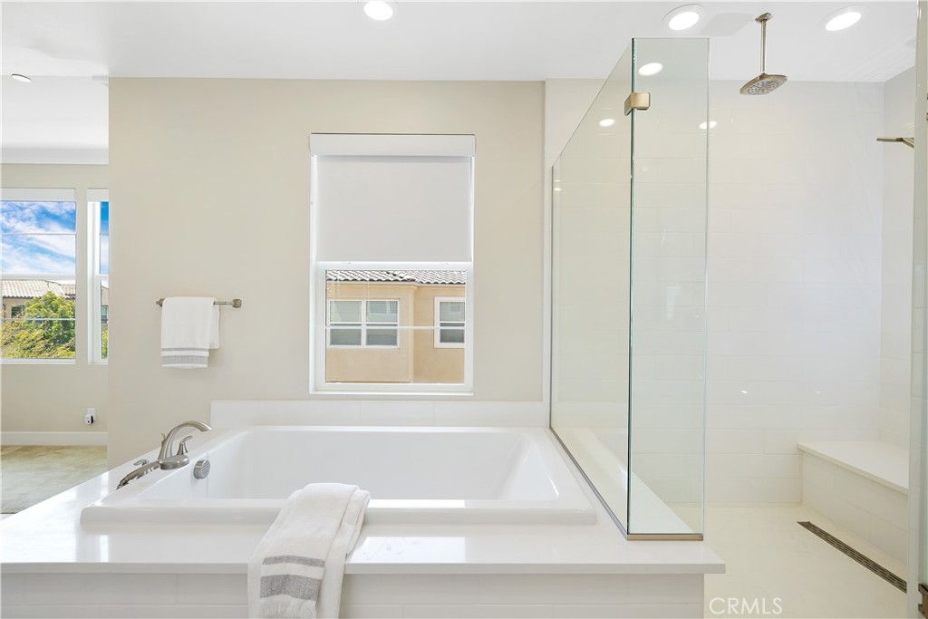 117 Swift Irvine, CA 92618 - Photo 39 of 62 a bathroom with a tub sink and a mirror