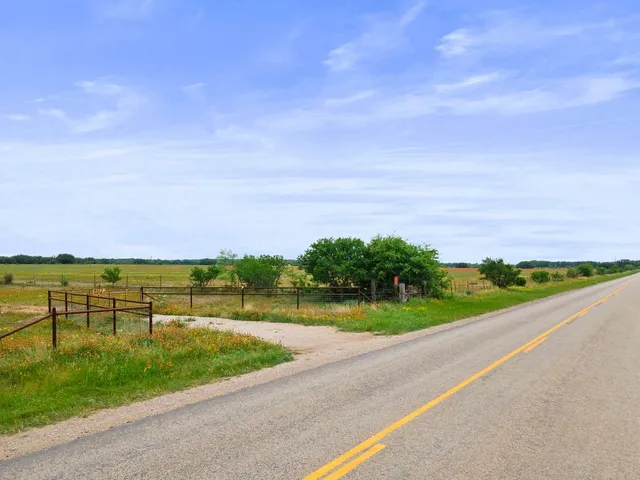 a view of a lake with houses in the back