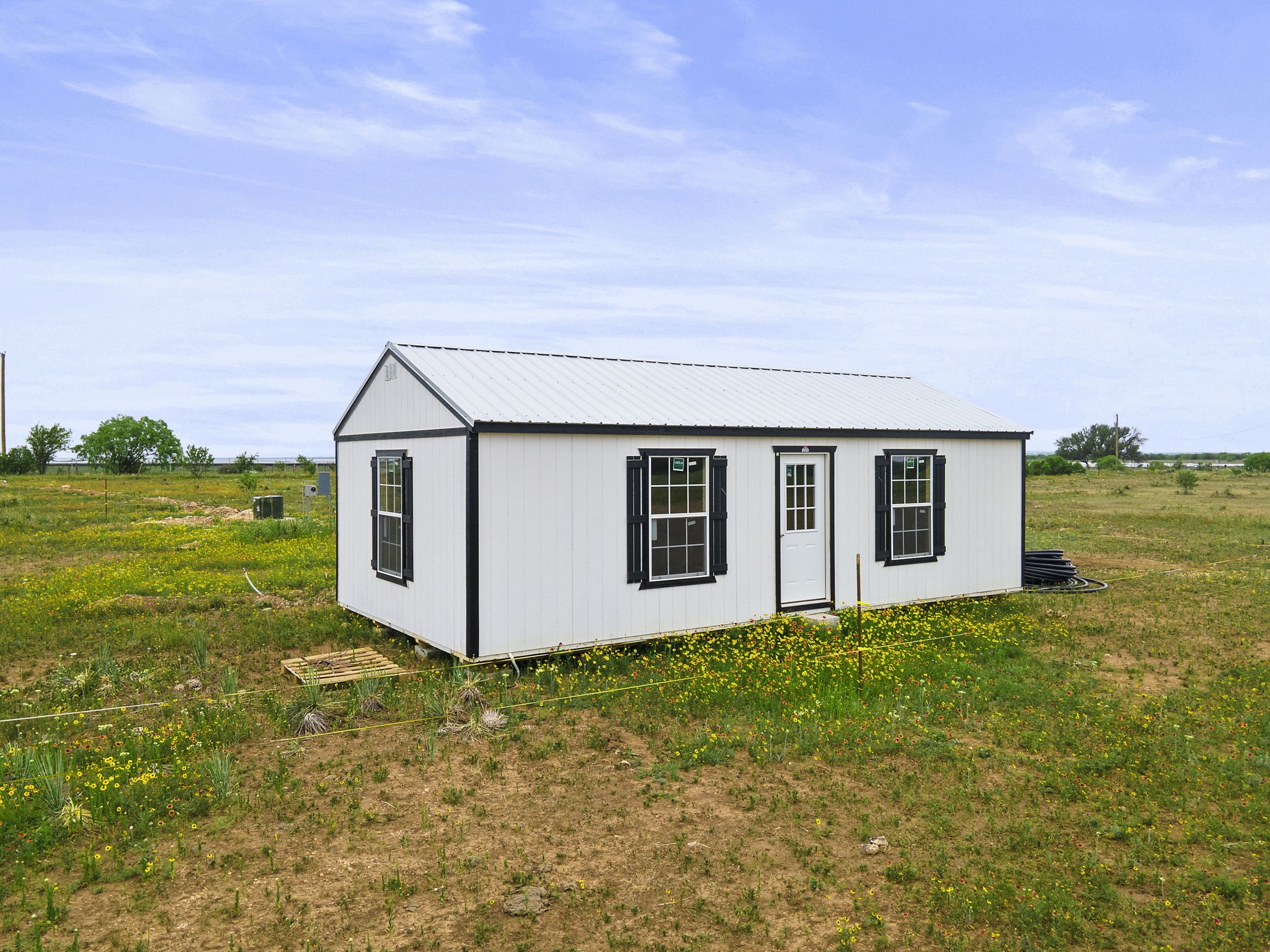 8557 Farm To Market 586 Bangs, TX 76823 - Photo 4 of 14 a house with garden in front of it