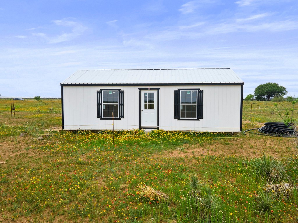 8557 Farm To Market 586 Bangs, TX 76823 - Photo 5 of 14 a front view of house with yard
