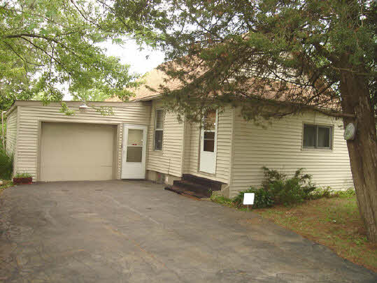 3452 Prairie Road Rockford, IL 61102 - Photo 1 of 6 a view of a house with a garage and a garage