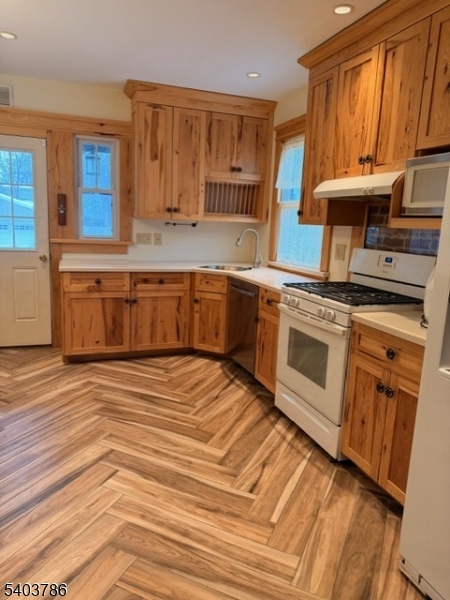 19 Academy Road Morris Plains, NJ 07950 - Photo 13 of 39 a kitchen with stainless steel appliances granite countertop a stove a sink and a microwave