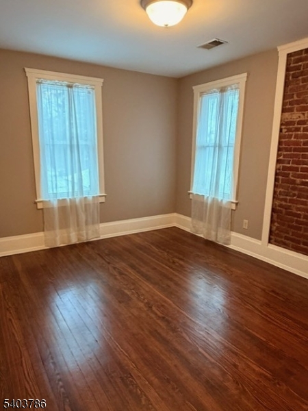 19 Academy Road Morris Plains, NJ 07950 - Photo 22 of 39 an empty room with wooden floor and windows