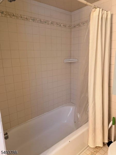 19 Academy Road Morris Plains, NJ 07950 - Photo 25 of 39 a bathroom with a shower and a bath tub