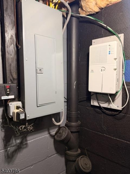 19 Academy Road Morris Plains, NJ 07950 - Photo 37 of 39 a room with water heater and wooden cabinets