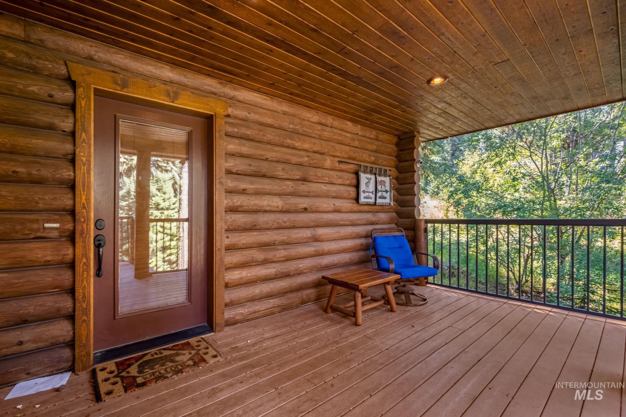1160 Bell Flower Place McCall, ID 83638 - Photo 3 of 45 Property entrance with log exterior and a deck