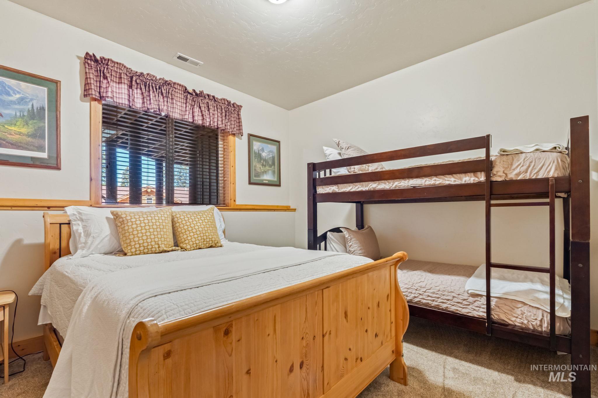 1160 Bell Flower Place McCall, ID 83638 - Photo 31 of 45 Bedroom with light carpet