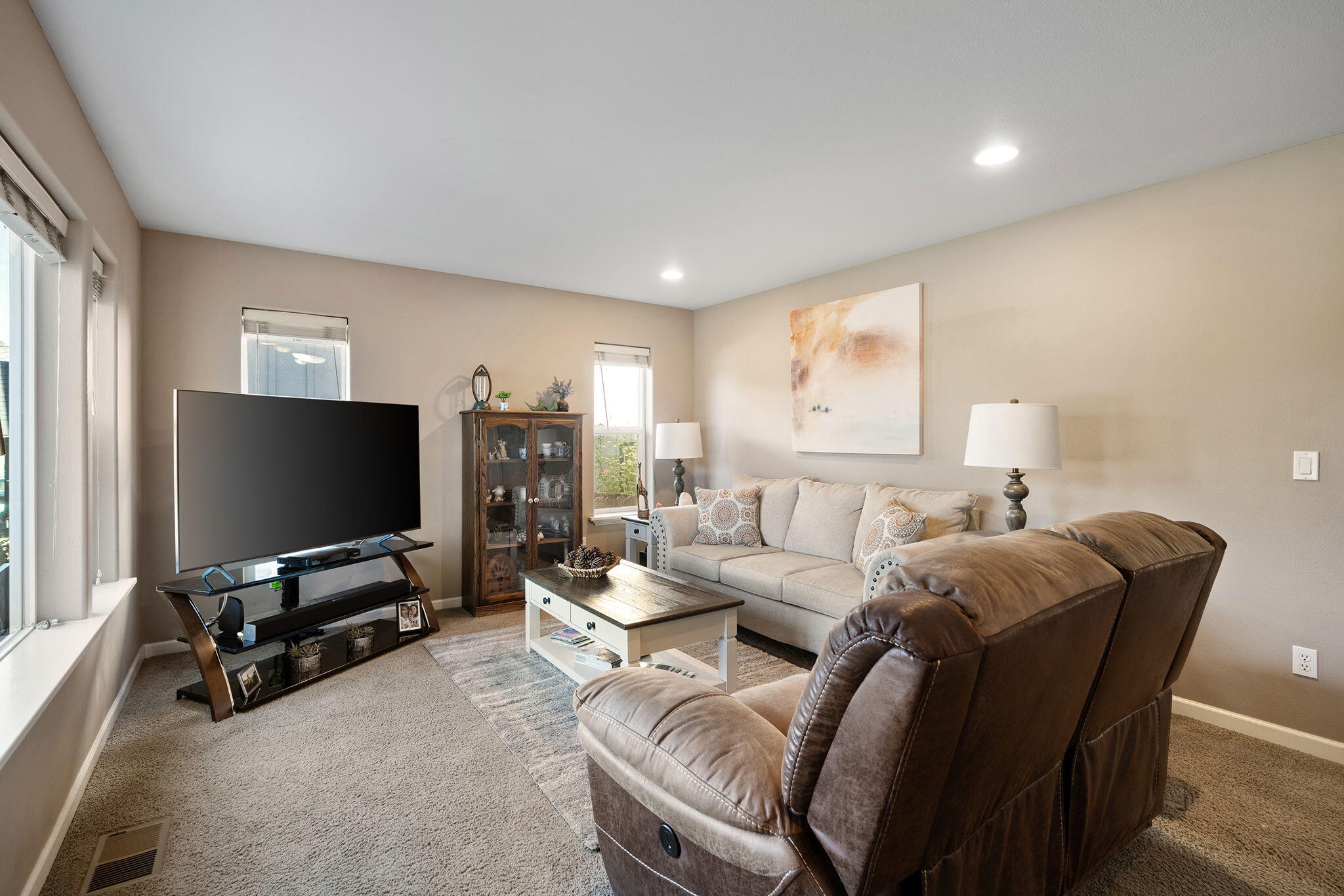 62906 Bilyeu Way Bend, OR 97701 - Photo 4 of 100 a living room with furniture and a flat screen tv