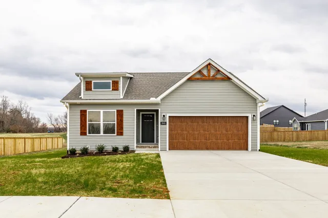 front view of a house with a yard