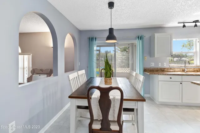 a view of a livingroom with furniture window and wooden floor