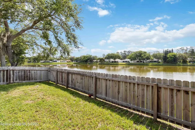 a view of backyard with seating and green space