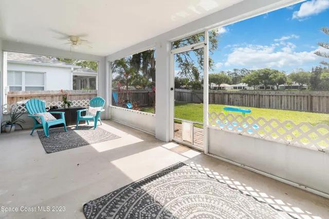 a view of a living room and floor to ceiling window