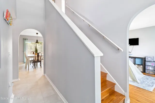 a view of a hallway with furniture and entryway