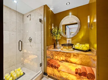 a bathroom with a mirror and a shower