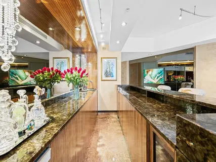 a view of a living room and kitchen