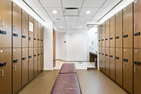 a view of a living room with furniture wooden floor and chandelier