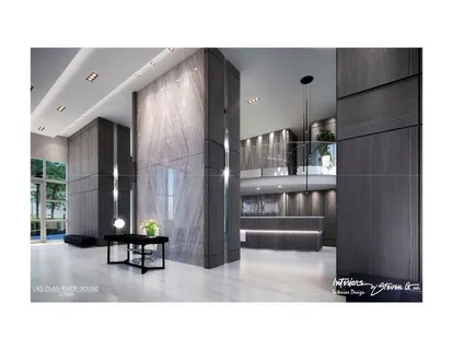 a living room with a couch and chandelier