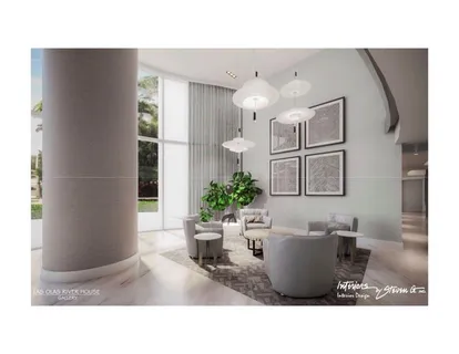 a living room with furniture and painting on the wall