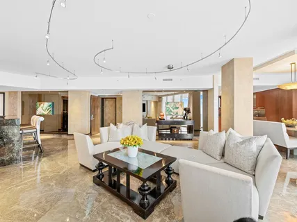 a living room with furniture and a table