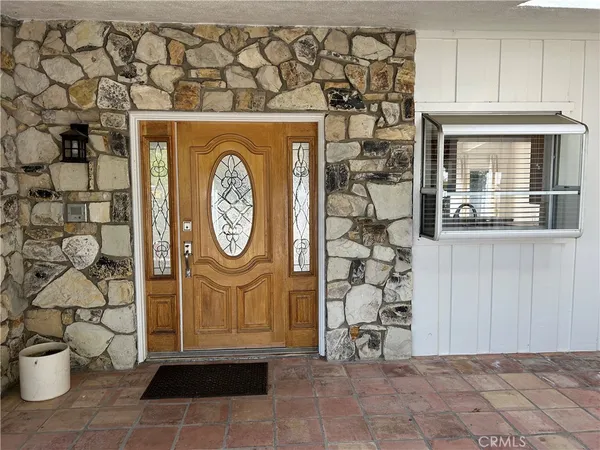 a view of a entryway with wooden floor