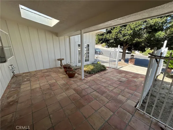 a bedroom with a bed and large window