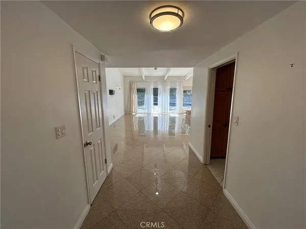 a large kitchen with kitchen island a sink stainless steel appliances and cabinets