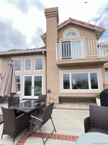 an aerial view of a house with swimming pool garden and patio