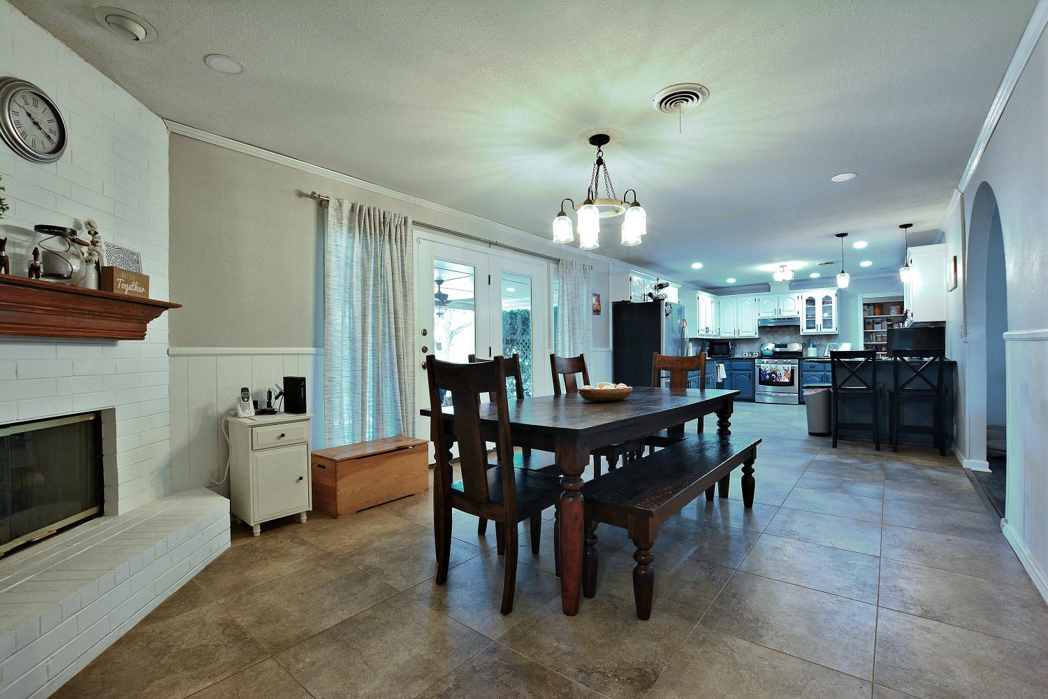 4903 17th Street Lubbock, TX 79416 - Photo 9 of 25 a view of a dining room with furniture and chandelier