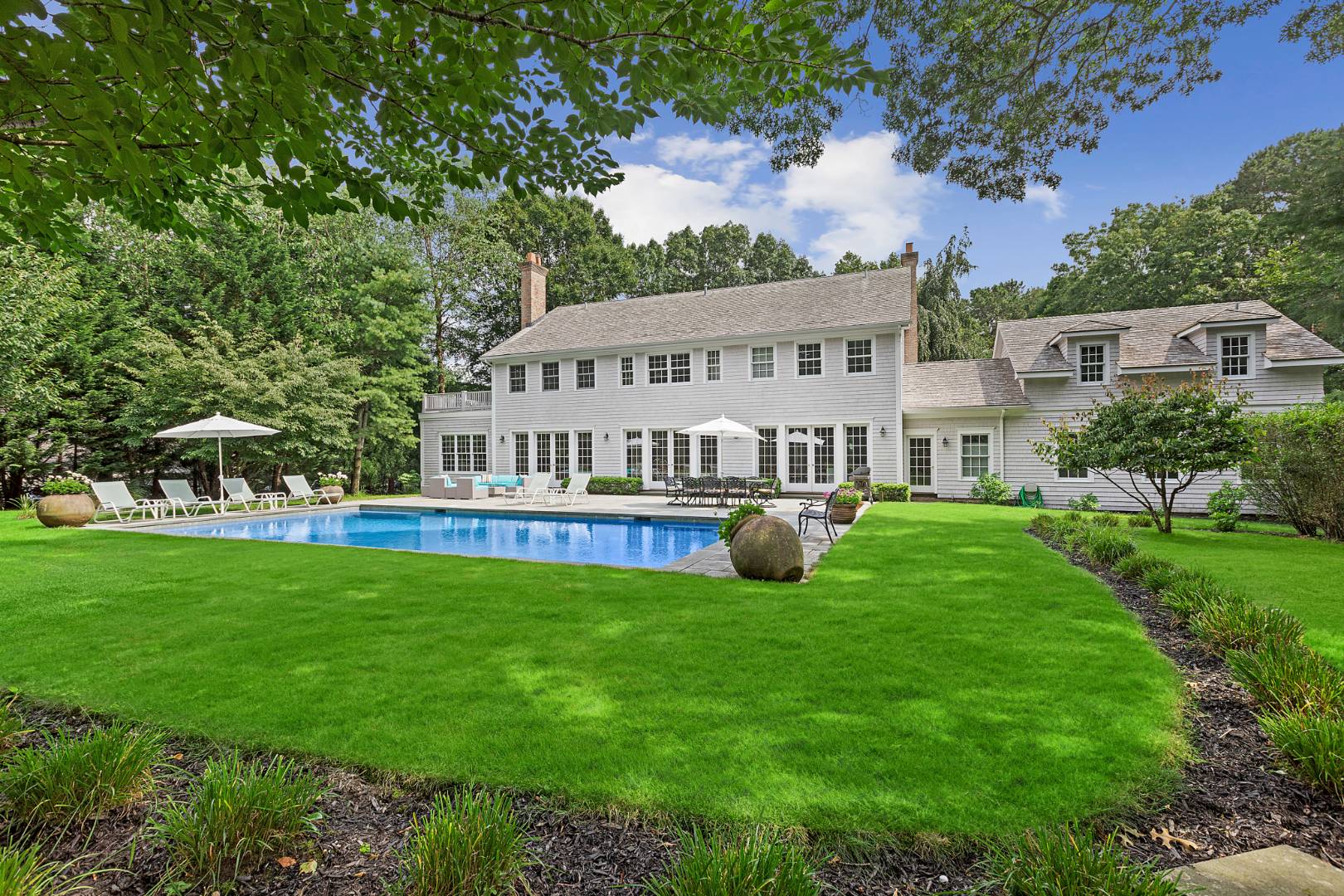 33 Cedar Trail East Hampton, NY 11937 - Photo 1 of 30 a view of a house with a big yard