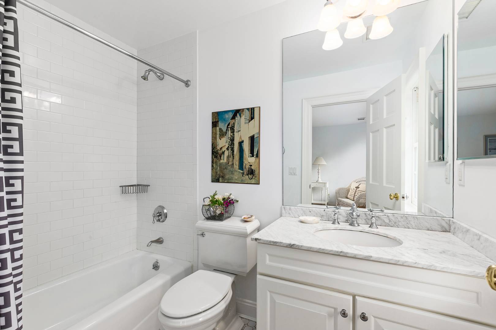33 Cedar Trail East Hampton, NY 11937 - Photo 24 of 30 a bathroom with a granite countertop sink toilet mirror and shower