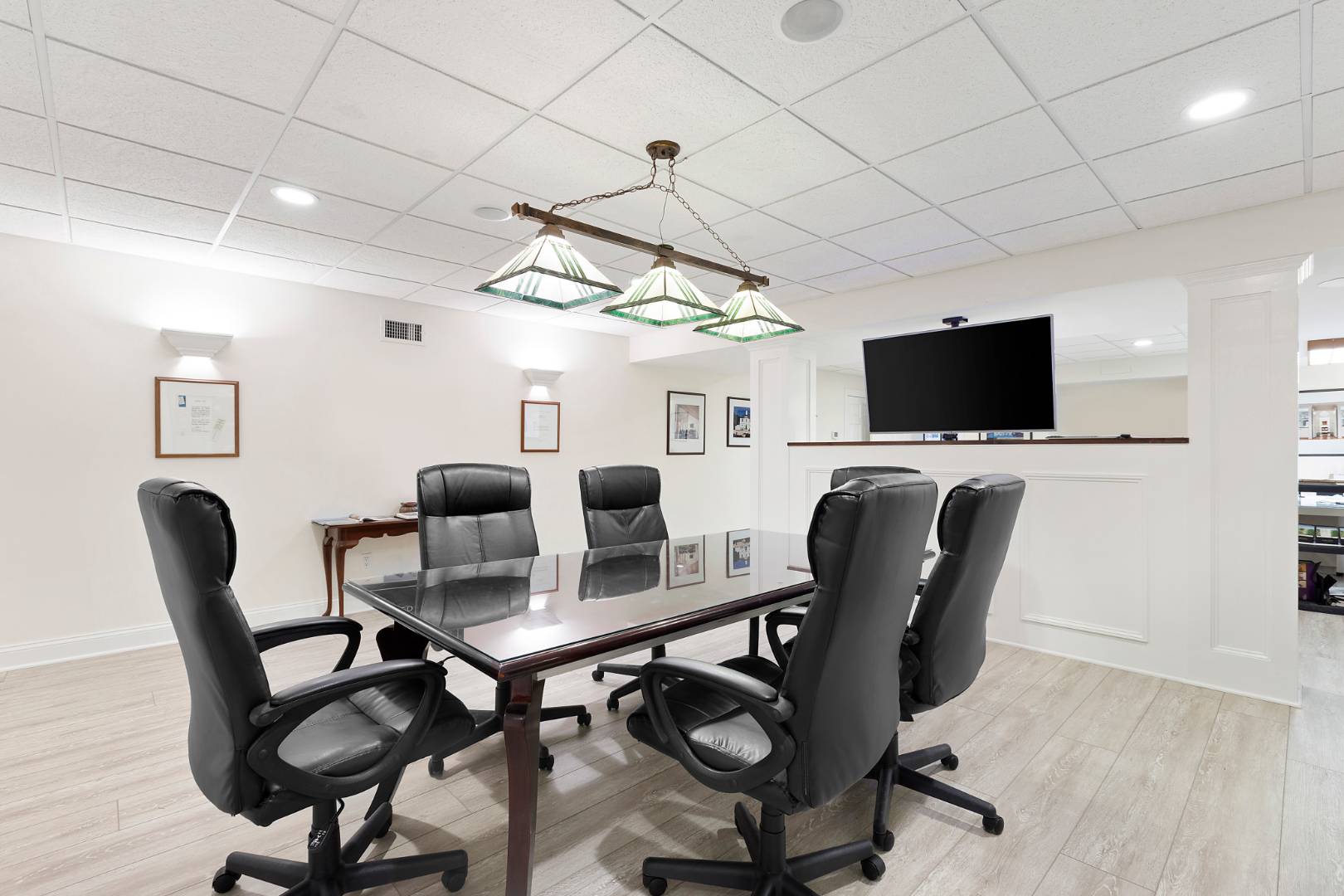33 Cedar Trail East Hampton, NY 11937 - Photo 26 of 30 a view of a workspace with furniture and a flat screen tv