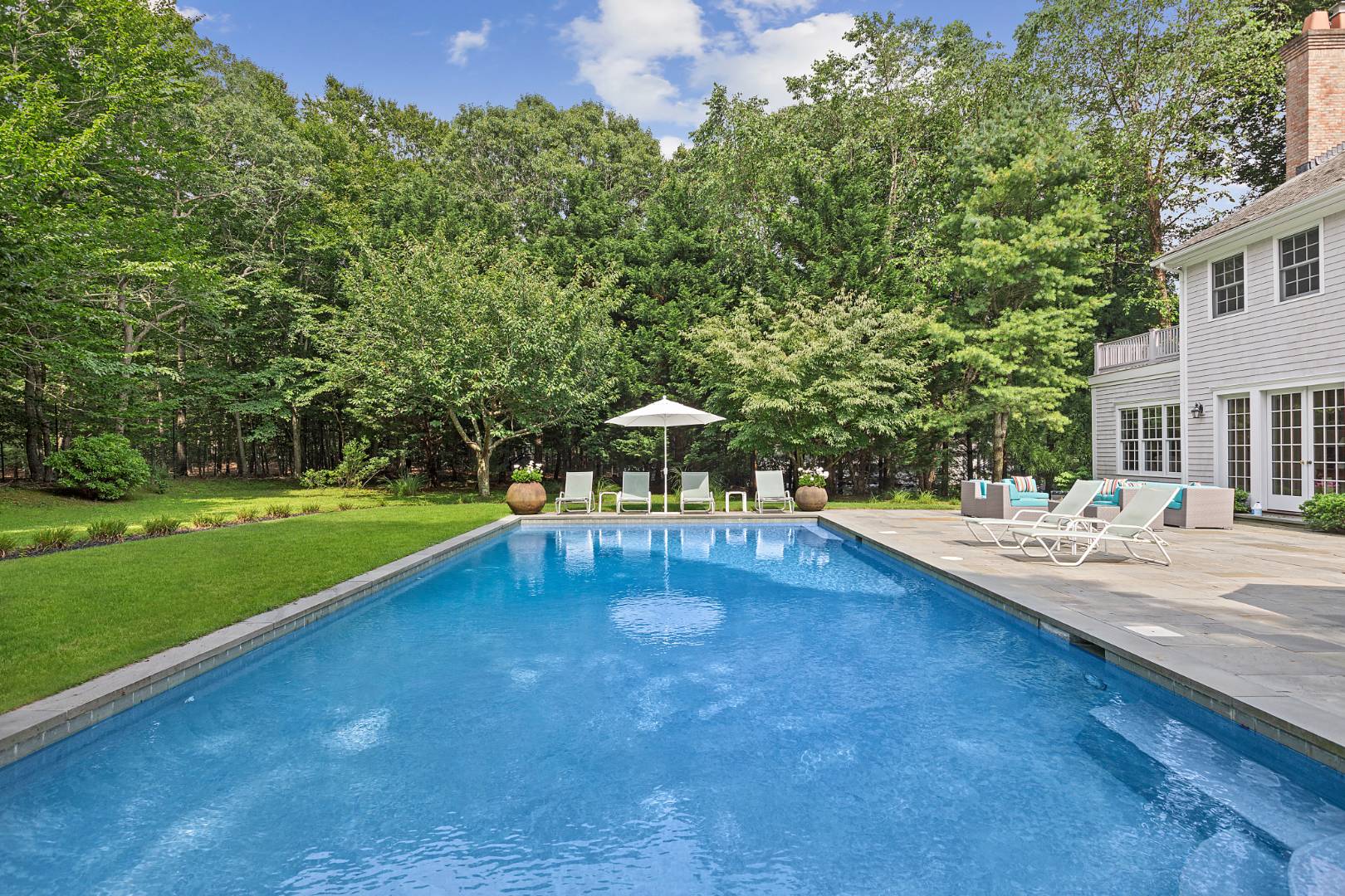 33 Cedar Trail East Hampton, NY 11937 - Photo 29 of 30 a swimming pool with outdoor seating and yard