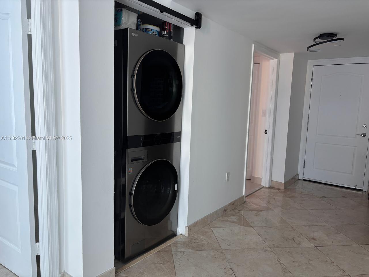 2101 Brickell Avenue, Unit 903 Miami, FL 33129 - Photo 12 of 22 a utility room with dryer and washer