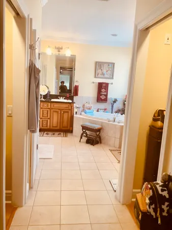 a bathroom with a sink a mirror and a bathtub