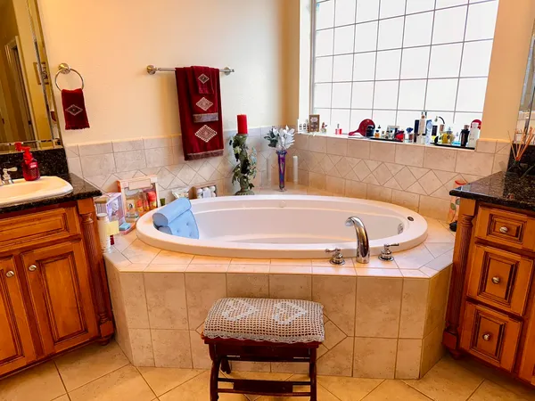 a bath tub sitting next to a window