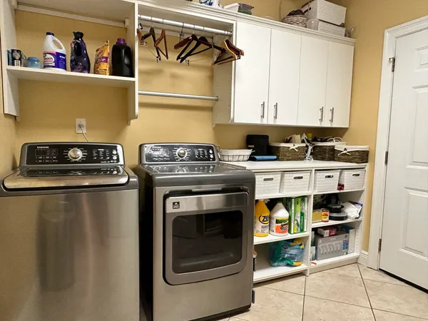 a utility room with dryer and washer
