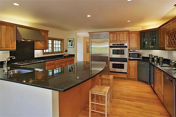 51 Dudley Road Newton, MA 02459 - Photo 6 of 12 a kitchen with stainless steel appliances granite countertop a sink a stove top oven a counter space and cabinets