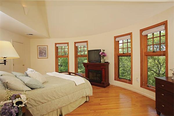 51 Dudley Road Newton, MA 02459 - Photo 8 of 12 a bedroom with a bed and wooden floor
