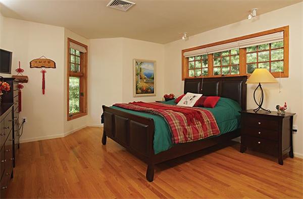 51 Dudley Road Newton, MA 02459 - Photo 9 of 12 a bedroom with a bed and wooden floor
