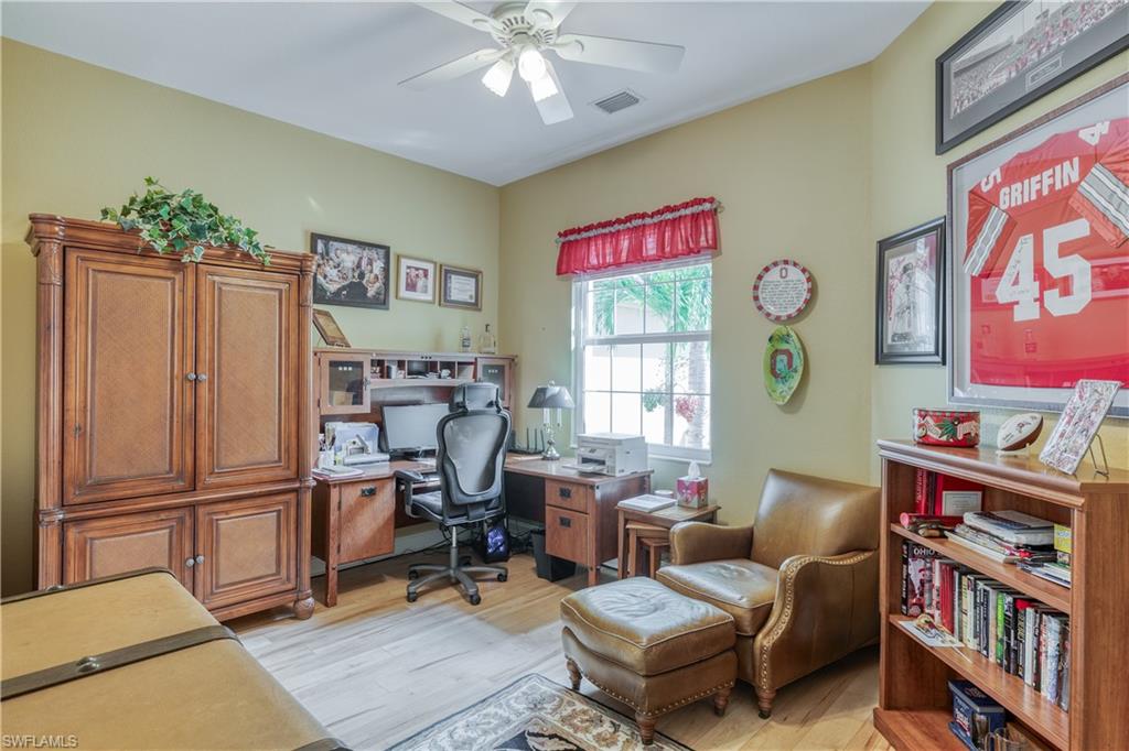 6017 Trophy Drive, Unit 603 Naples, FL 34110 - Photo 13 of 23 a living room with furniture and a window