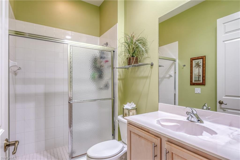 6017 Trophy Drive, Unit 603 Naples, FL 34110 - Photo 14 of 23 a bathroom with a sink toilet and shower