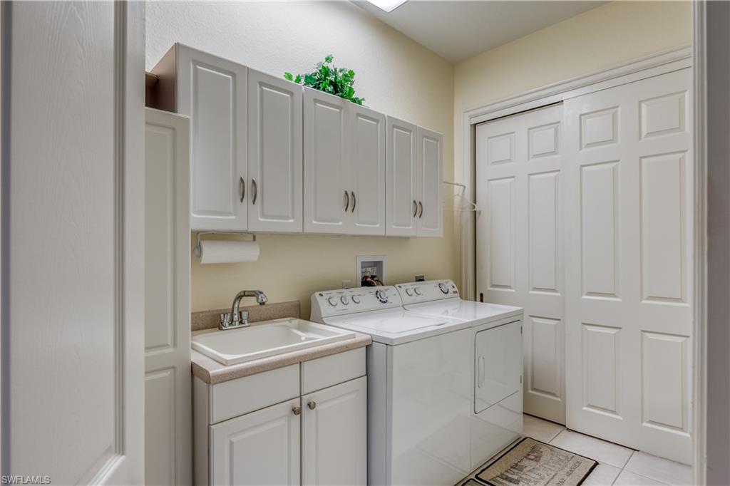 6017 Trophy Drive, Unit 603 Naples, FL 34110 - Photo 16 of 23 a utility room with sink dryer and washer