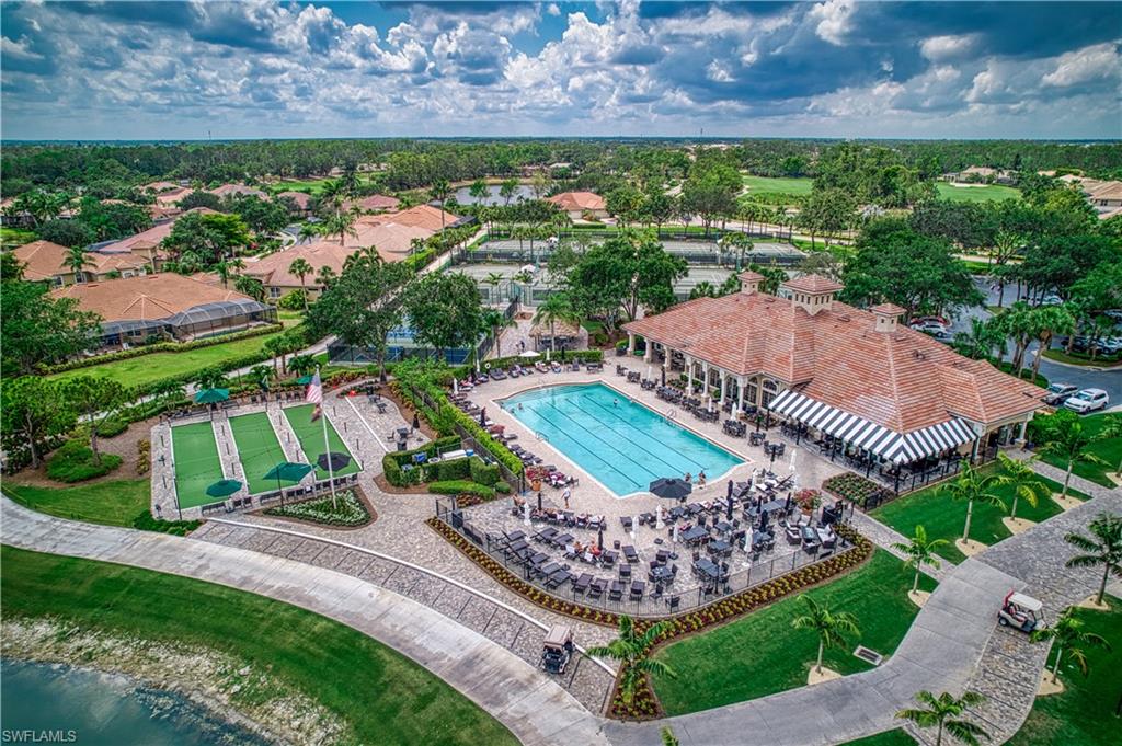 6017 Trophy Drive, Unit 603 Naples, FL 34110 - Photo 18 of 23 a view of a city and a yard