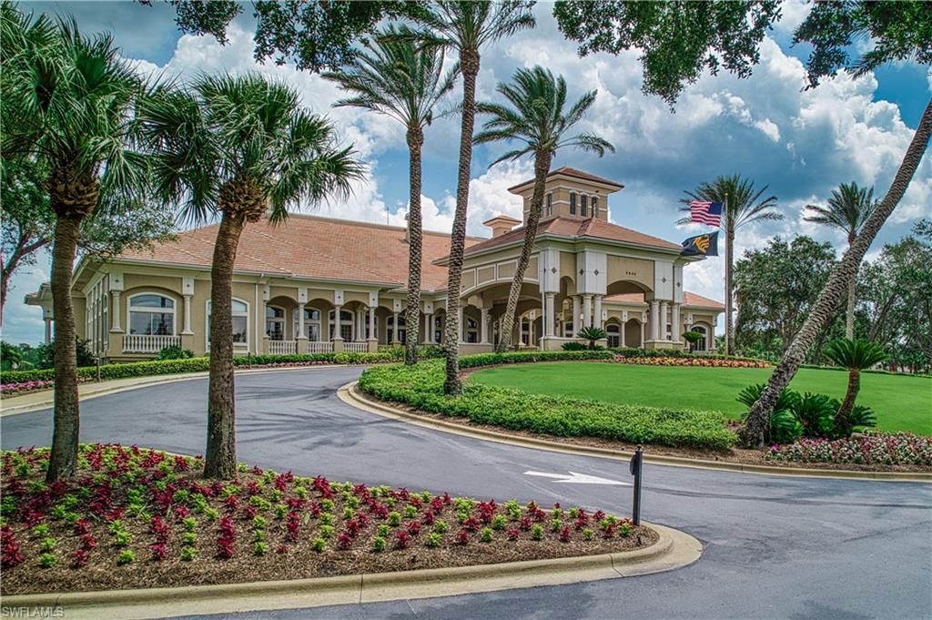 6017 Trophy Drive, Unit 603 Naples, FL 34110 - Photo 23 of 23 a front view of a house with garden