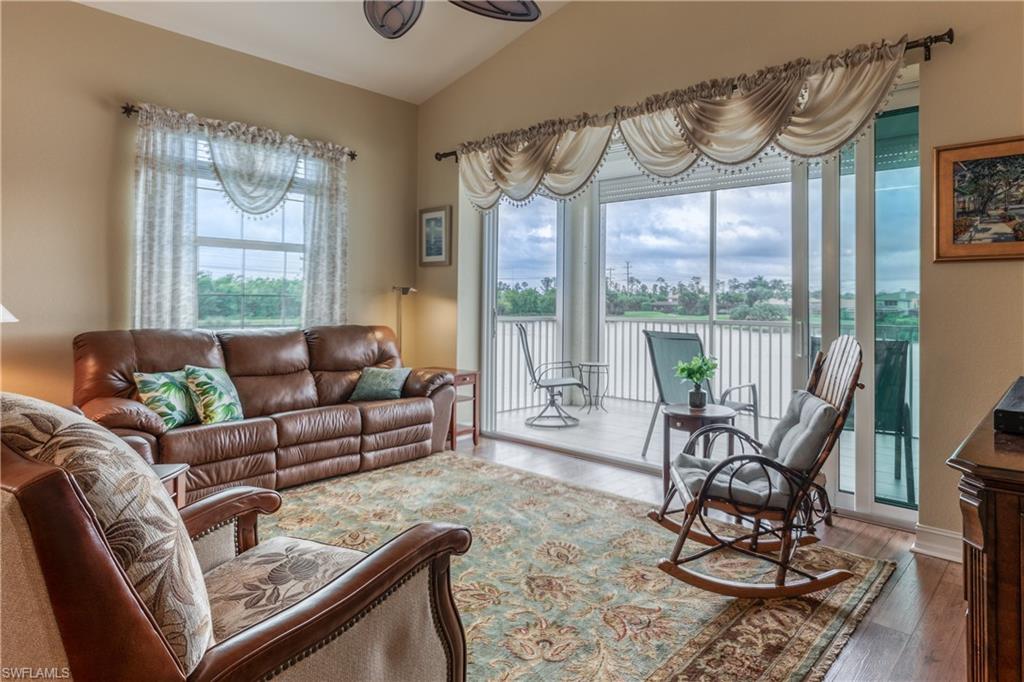 6017 Trophy Drive, Unit 603 Naples, FL 34110 - Photo 3 of 23 a living room with furniture and a large window